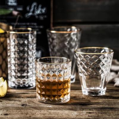 China Different style design elegant drinking glasses available in wholesale price lead free glass with gold rim for sale