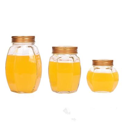 China Hot Selling Empty Steamable Wholesale Price Big Belly Hexagon Glass Honey Jar for sale