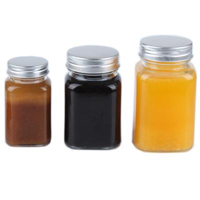 China High End Square Shape Food Contact Safe Wholesale Price Different Sizes Honey Jars Unique Glass for sale