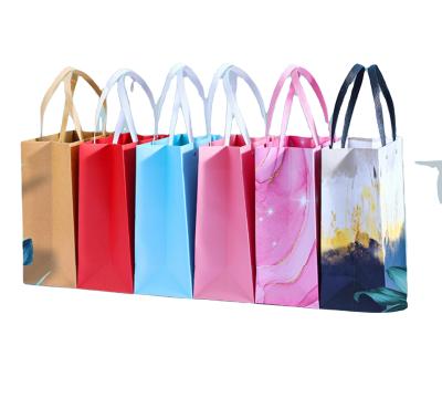 China Recyclable Custom Kraft Paper Bags Newly Design Customizable Starbust Bags Tote Hand Bag For Gift And Craft for sale