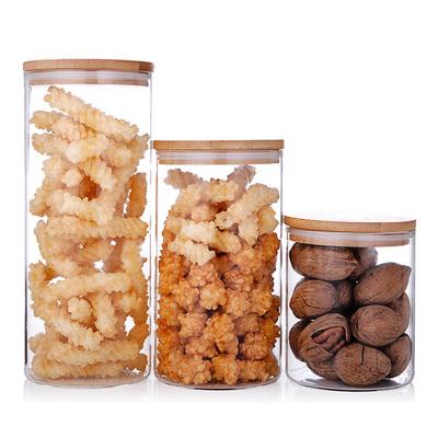 China Sustainable Kitchen Use Good Storage Jar Clear Glass Jars with Bamboo Lid for Spice Candy for sale