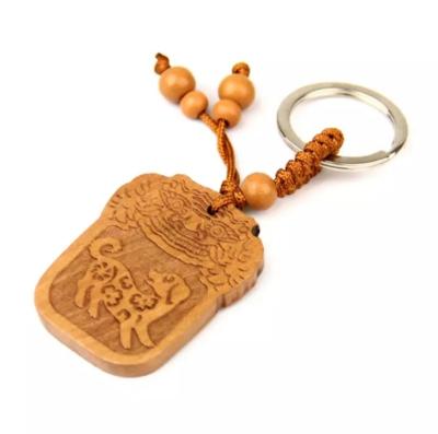 China China wood carved zodiac pendant dog for sale