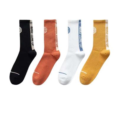 China Autumn and winter design breathable hot selling basketball bangs men's cotton tube solid color medium long tube socks for sale