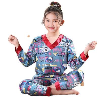 China Custom Breathable Long Sleeve V-neck Pajamas Kids Girls Silk Sleepwear Set for sale