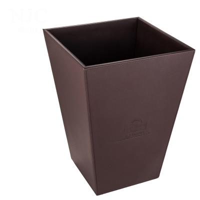 China 2021 Custom Appearance Hotel Custom Logo Brown Trapezoid Durable And Exquisite Standard Size Leather Home Garbage Bin for sale