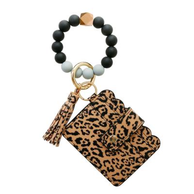 China New Silicone PU Wristband Silicone Elastic Band Tassel Collection Card Bag Silicone Leather Key Chain Strap For Key Chain for sale