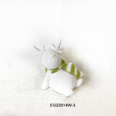 China 100% Ceramic Sitting Dolomite Christmas Home Decorations Elk In White Color With Fabric Scarf for sale