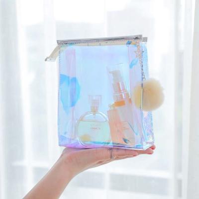 China Wholesale Cute Magic Shiny Vinyl Waterproof Cosmetic Clear Rainbow PVC Laser Makeup Bag Transparent Bag for sale