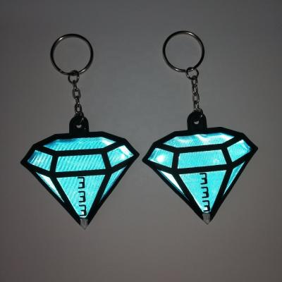 China Promotional Custom Diamond Shaped Plastic Reflective Key Ring Pvc Soft Reflective Key Chain Pvc+eva+battery+led+matal for sale