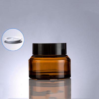 China 15g 30g 50g Recyclable Amber Brown Empty Cosmetic Sample Jar Glass Cream Jars With Black Lid for sale