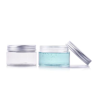 China 100g Empty Wide Mouth Clear Aluminum Cap Wide Mouth Cream Jars Cosmetics Packaging Emulsion PET Plastic Jars for sale