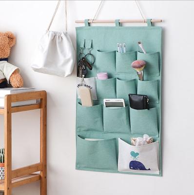 China Sustainable Easy Storage Organizer Wall Hanging Bag Sundries Storage Bag for sale