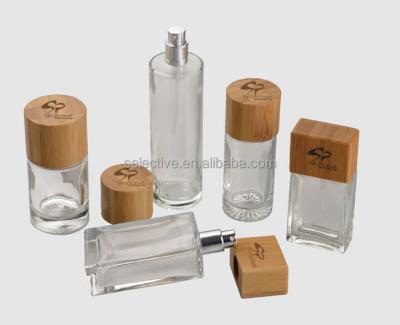 China Personal Care Perfume Packaging Spray Glass Bottles With Wooden Lids Wholesale for sale