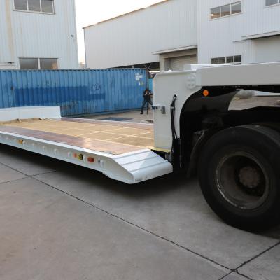 China Semi Truck Trailer Factory Flat Bed 3 Axle 60Tons Truck Trailer Rim 16 Rim Trailer for sale