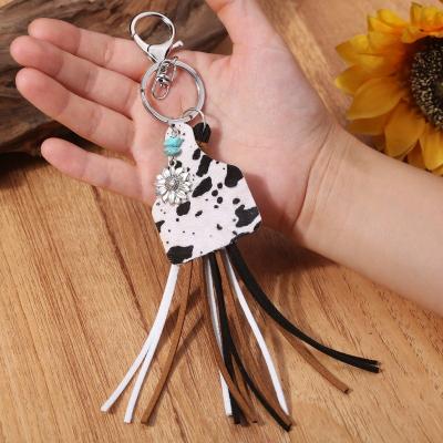 China Hot Selling Metal Chain Accessories Hot Retro Leopard Cow Style Cow Leather Tassel Western Aztec Geometric Printing for sale