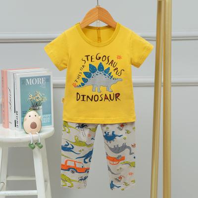 China El pijama cómodo lindo del dinosaurio suave fija cortocircuito amistoso de la piel amarilla envuelto en venta