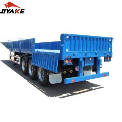 China New and used 3 axle truck trailer 60 ton trailer cargo sidewall flatbed trailer dropside semi boards with twist lock for sale