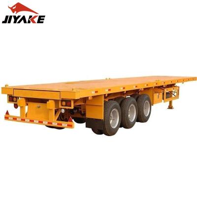 China Tri axles 40ft flat bed container truck 12tires shipping container trailer flatbed semi trailer truck for Ethiopia for sale