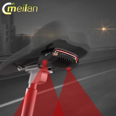 China Waterproof Streamline Light Safety Flashlight Meilan X5 Bike Laser Tail Wireless Remote Control Rotating Recycling Light for sale