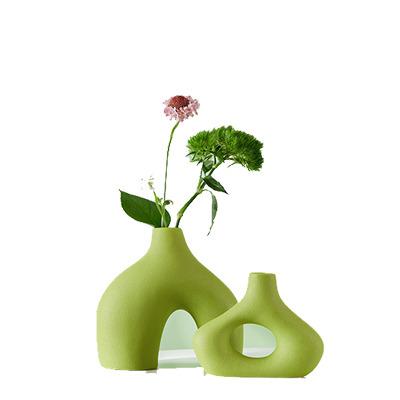 China Avocado Modern Geometric Irregular Heterosexual White Green Rose Decoration Tabletop Ceramic Flower Vase for sale