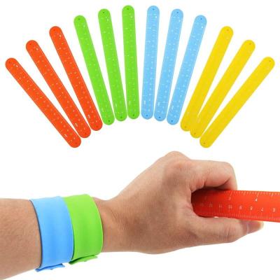 China Eco Friendly Colorful Rubber Snap Bracelet Custom Logo Silicone Wristband Printing Design Design for sale