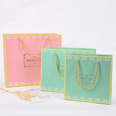 China Chinese Manufacturer BIODEGRADABLE Customize Paper Bag Handle Paper Bag For Clothing Mini Paper Bag for sale