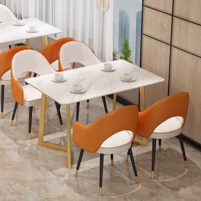 China Modern Table Most Popular Designer Restaurant Table Sintered Stone Marble Dining Table With Gold Legs for sale