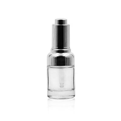 China 30ML 35ML Cosmetic Luxury High End Round Transparent Eye Cream Essential Oil Glass Bottle With Silver Pressure Dropper for sale