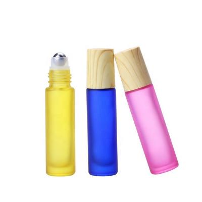 China Wholesale Recyclable Empty Colorful 10ml Roll On Essential Oil Eye Cream Perfume Glass Cosmetic Packaging Bottle With Stainless Steel Roller for sale