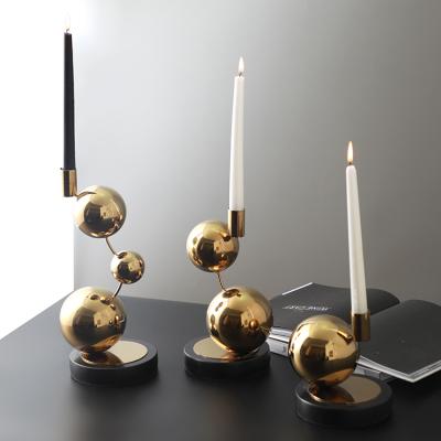 China High quality luxury dining table centerpieces stainless steel candle holder shiny gold candlestick for wedding for sale