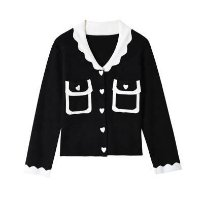 China Anti-wrinkle 2022 latest heart design long sleeve black and white slim French cardigan women sweater set for sale