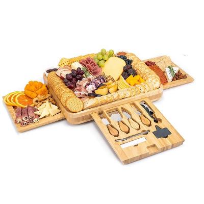 China Amazon Sustainable 2022 Hot Sale Bamboo Cheese Board Round Kitchen Charcuterie Boards Swivel Meat Tray Personalized Tray Knife Set for sale