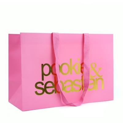 China Recyclable Gold Foil Gift Custom Logo Recycled Pink Paper Shopping Bag With Handles for sale