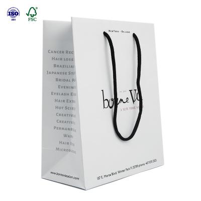 China Recyclable Custom Printing Clothing White Paper Shopping Bags With Your Own Logo for sale