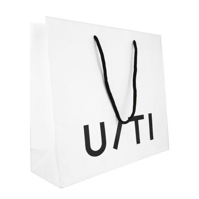 China Recyclable Custom Logo Gift Shopping White And Black Paper Bag With Handle for sale