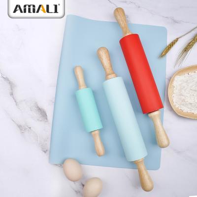 China Traditional Colorful Silicone Baking Tools Rolling Pin With Wood Handle for sale