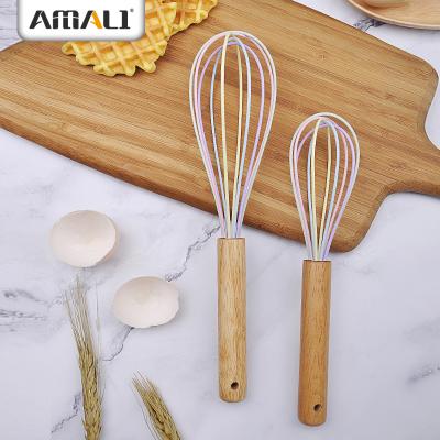 China Traditional Colorful Silicone Tools Egg Cooking Beater With Rubber Wood Handle With Hole for sale