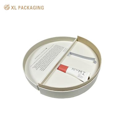 China Embossing LOGO Medio círculo Caja especial de papel cosmético para el cuidado de la piel con perfume EVA en venta