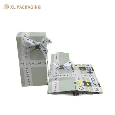 China Cardboard Paper Foldable Card Box Folder Lip Packaging Box With Ribbon Bow for sale