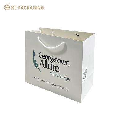 China Paper Bag Company Logo Shop Clothes & Shoes Packaging Shopping Bag Coated Paper High Quality Hand Bag for sale