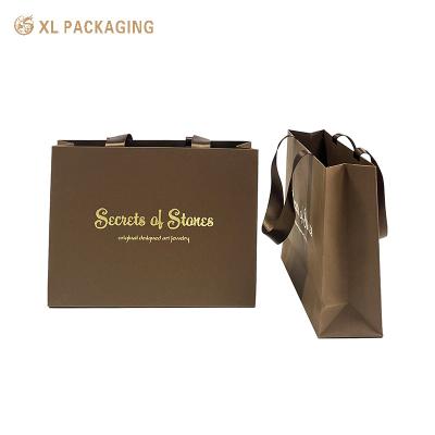 China Brown One Paper Bag Handmade Custom Logo Packaging Cosmetic Products Shopping Bag with Handle for sale