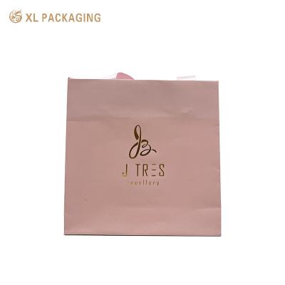 China Custom Color Pink Present Paper Packaging Bags Gift Shipping Bag Logo Printed for sale