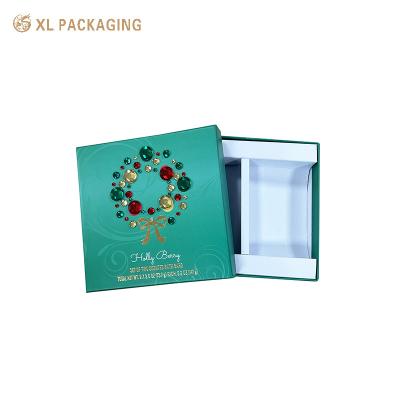 China Custom groene luxe verpakking kerst verpakking decoratie bogen goud warm stempel deksel en basis dozen voor cosmetica Te koop