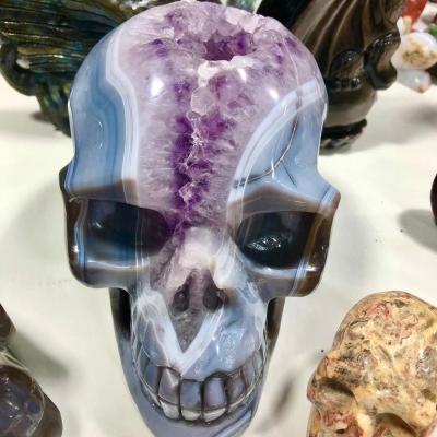 China China Wholesale Natural Healing Ore Semi Precious Stone Hand Carved Realistic Geode Crystal Skulls Agate Amethyst for sale