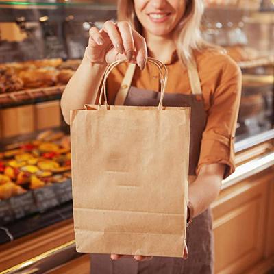 China Recyclable Wholesale Big Lift Supermarket Kraft Paper Bags With Printed Logo for sale