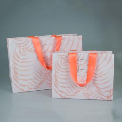 China Recyclable Hot Sale Ribbon Handle Silk Stain Portable Custom Textured Gift Wrapping Bag Gift Wrapping Bag for sale