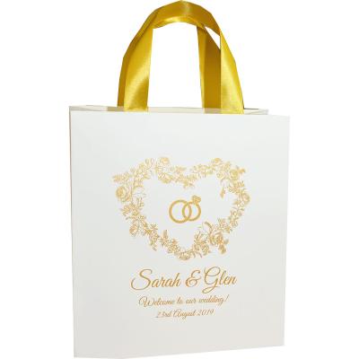 China Custom Design Recyclable Wholesale Cheap Price White Printing Candy Bags Wedding Gift Bag for sale