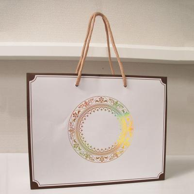 China Custom Logo Eco-friendly Recyclable Paper Shopping Bag Recyclable With Handle For Business for sale