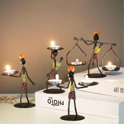 China Home Decoration Drop Shipping Creative Nordic Handsome Candlestick Bar Restaurant Decor Abstract Iron Men Design Candle Holder for sale