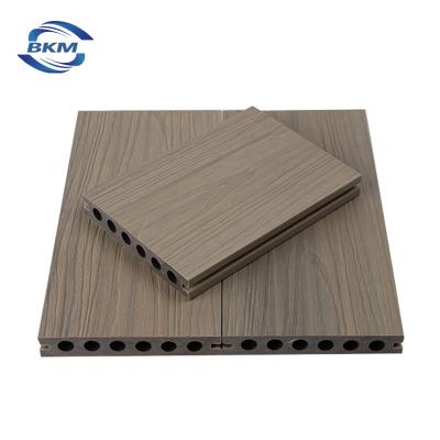 China Modern High Quality Wood Grain Decking WPC Wood Plasit Waterproof Anti-UV Covered Composite Co-Extrusion for sale